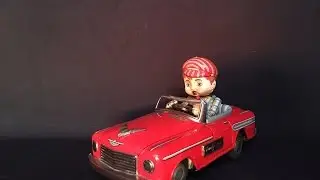 Lucky Car Smoking Japan Battery Operated Tin Toy, Marusan, 1950s