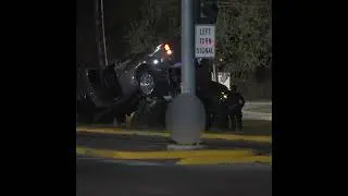 Truck ends up on car during fatal crash