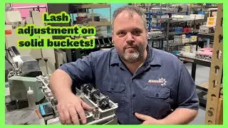 How do we set lash adjustment with solid buckets?