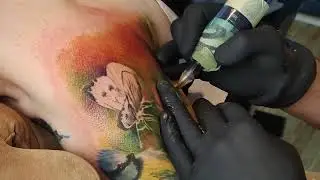 Colorful tattoo sleeve process. Time lapse tattooing.