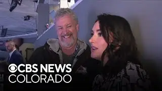 CBS Colorado's Romi Bean gets tips from Alan Roach, Avs PA announcer, at Ball Arena