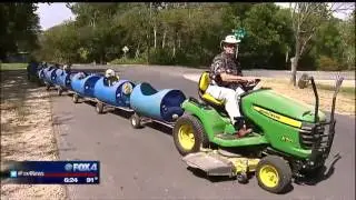 Animal lover builds train for dogs