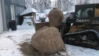 The challenges of feeding cattle in Alaska.  EVERYTHING is frozen: hay, fodder and spent grain.