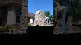 Hand building a stone fireplace.