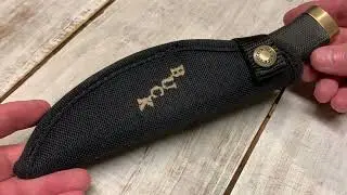 Buck 692 USA fixed blade hunting knife with advertising and nylon sheath. Interesting knife