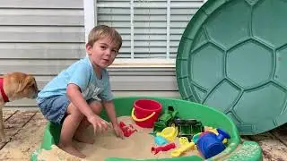 Shovel digging in the sandbox. Preschool fun.