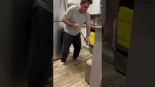 Sweeping the floor after dinner