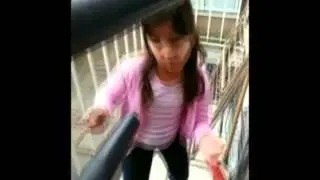 Dilys Kungfu girl training WingChun style with Wooden Dummy conditioning arm.