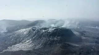 Panoramic view of smoking volcanic landscape after eruption. Solid lava streams on hill slopes
