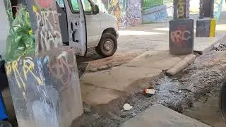 A makeshift auto body shop on the edge of Brooklyn.
