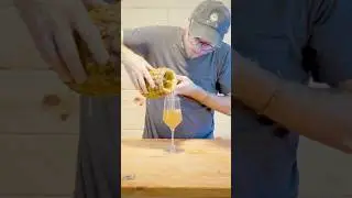 Tasting tepache fermented in a pineapple