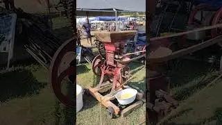 Antique Corn husker run by a hit and miss steam engine