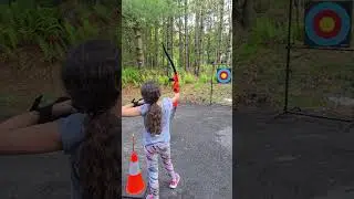 Teach them young, archery skills first day with her bow