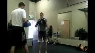 Ray Pickett hitting the pads with AJ Poulsen
