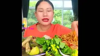 Eating spicy papaya salad with fermented fish sauce and bamboo shoot curry