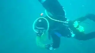 Scuba Diver With Underwater Equipment Problems On A Shipwreck