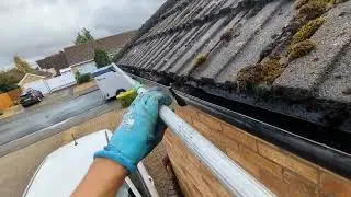 Using a pole to clean a difficult gutter, clever tool!