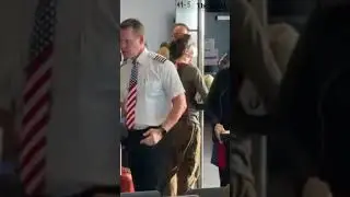 A Southwest Airport pilot hands out coffee to delayed passengers