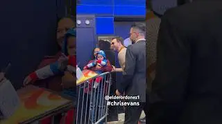Chris Evans takes a selfie with a little fan dressed as Captain America while leaving GMA inNew York