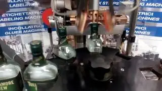 ENOLMAC SRL - TAX STRIPS LABELING MACHINE AUTOMATIC mod S75/4