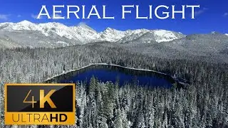 Aerial Flight Over a Wintery Snow Coated Lake (4K UHD) | پرواز هوایی بر فراز یک دریاچه