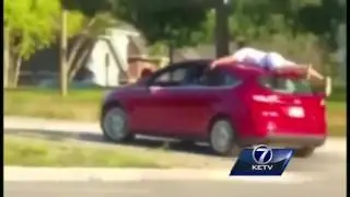 Video catches teens 'car-surfing'