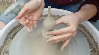 Throwing a miniature vase off the hump
