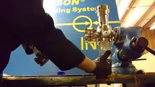 Sampling hazardous chemical into a bottle holder