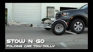 Folding Car tow dolly - with Surge Brakes used to tow cars suvs minivans small trucks