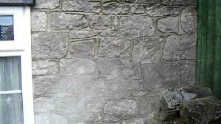 waterproofing a stone wall 1 of 3
