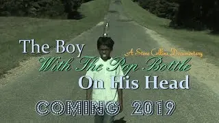 The Boy With The Pop Bottle On His Head 