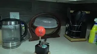 Water Sticking to a Ball Spinning at Speed of Earth