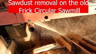 Removing sawdust on the Frick Circular sawmill