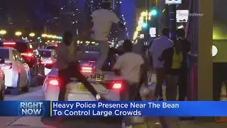 Large rowdy crowds congregate in Millennium Park, draw large police presence