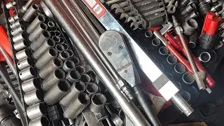 Emptying my toolbox by hand to temporarily secure tools in storage.