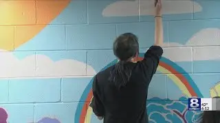 Students install mural at Avenue D R-Center