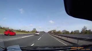 Dash cam captures close call after driver fails to check blind spot while emerging onto motorway