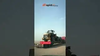 Lowboy Trailer Action: Transporting a Colossal Wheel Loader!🚛💥