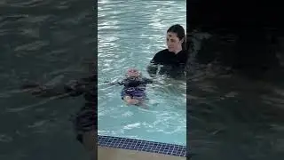 Baby Cooper during infant aquatics class at 10 months old