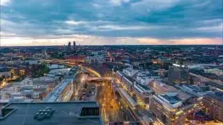 Fly above evening city. Transport infrastructure and popular landmarks at sunset. hyperlapse shot of