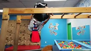 Toddler hanging upside down