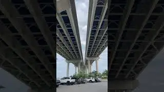 Arthur Ravenel Jr. Bridge & the entrance to Mt. Pleasant Pier, a pier with leisure facilities, SC