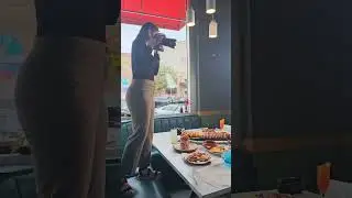 She Climbed a Booth for the Perfect Food Shot&hellip; and Got a Surprise Audience!