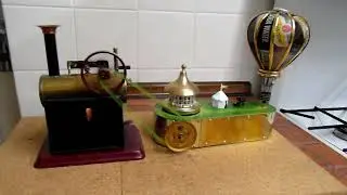 Doll 309-1 with fairground/balloon ride toy