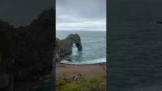 Holidays at Durdle Door - grey skies and a quiet beach during the height of the 2023 summer season