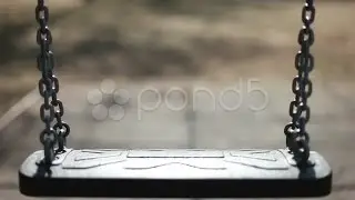 Empty Swing Swaying. Stock Footage