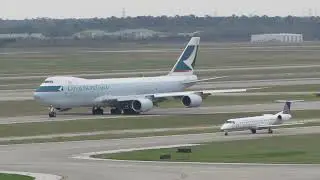Cathay Pacific Cargo 747 & United Express Parallel Taxi @ IAH (03/02/2014)