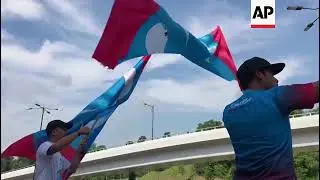 Flag-waving Malaysians cheer opposition election victory