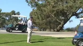 President Obama waves from golf cart at Torrey Pines Golf Course