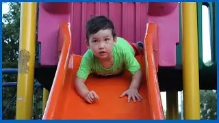Asian child boy playing on the outdoor playground in Istanbul. Healthy summer activity for children.